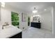 Modern bathroom featuring dual sinks, elegant fixtures, and natural lighting at 1348 Timberland Se Dr, Marietta, GA 30067