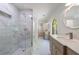 New bathroom featuring a glass shower and a double sink vanity with marble floors and walls at 1348 Timberland Se Dr, Marietta, GA 30067