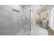 New bathroom with a glass shower and a double sink vanity with marble floors and walls at 1348 Timberland Se Dr, Marietta, GA 30067