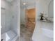 Modern bathroom featuring a glass shower and vanity with quartz countertop and a framed mirror at 1348 Timberland Se Dr, Marietta, GA 30067