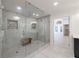 Modern bathroom with tiled shower, glass door and bench seating at 1348 Timberland Se Dr, Marietta, GA 30067