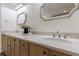 Elegant bathroom features double sinks, custom wood cabinets, and marble countertops at 1348 Timberland Se Dr, Marietta, GA 30067
