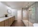 Large primary bathroom featuring double sink vanity, glass shower, and neutral tile at 1348 Timberland Se Dr, Marietta, GA 30067