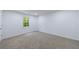 This bedroom is freshly painted and features neutral carpet and a window at 1348 Timberland Se Dr, Marietta, GA 30067