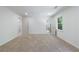 Bright bedroom with neutral carpet, fresh white paint, multiple doorways, and a window with a view of nature at 1348 Timberland Se Dr, Marietta, GA 30067