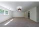 Spacious bedroom with carpet, window, and ensuite bath access at 1348 Timberland Se Dr, Marietta, GA 30067