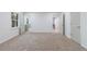 Bedroom featuring neutral carpet, two entries to other rooms, and 2 large windows at 1348 Timberland Se Dr, Marietta, GA 30067
