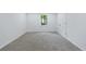 A cozy bedroom offers plush carpeting, a window to the backyard and white walls at 1348 Timberland Se Dr, Marietta, GA 30067