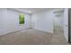 Bright bedroom with carpeted floors, a window with natural light, and closet doors at 1348 Timberland Se Dr, Marietta, GA 30067