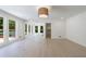 Light-filled bedroom with hardwood floors, closet, and French doors leading to the outdoor pool area at 1348 Timberland Se Dr, Marietta, GA 30067