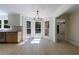 Cozy dining area with three-sided windows, light hardwood floors, and modern lighting at 1348 Timberland Se Dr, Marietta, GA 30067