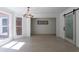 Sunlit dining room featuring a sliding pantry door, large windows, modern light fixture and hardwood floors at 1348 Timberland Se Dr, Marietta, GA 30067