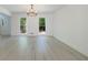 Dining space showcasing large windows, light wood floors, and natural light at 1348 Timberland Se Dr, Marietta, GA 30067