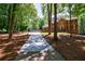 Long driveway leading to a brick home with lush landscaping, offering a grand entrance and a sense of privacy at 1348 Timberland Se Dr, Marietta, GA 30067