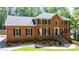 Charming brick home features a well-manicured lawn and classic architectural details at 1348 Timberland Se Dr, Marietta, GA 30067
