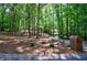 Spacious front yard with mature trees and manicured landscaping leading to a brick home at 1348 Timberland Se Dr, Marietta, GA 30067