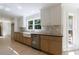 Bright kitchen with stainless steel appliances, farmhouse sink, and ample counter space at 1348 Timberland Se Dr, Marietta, GA 30067