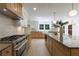 Gourmet kitchen showcasing an island, stainless steel appliances, and modern lighting at 1348 Timberland Se Dr, Marietta, GA 30067