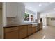 Stylish kitchen with two-tone cabinets, farmhouse sink, stainless steel appliances, and bright natural light at 1348 Timberland Se Dr, Marietta, GA 30067