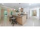 Open kitchen featuring a large island, modern appliances, and connection to dining room at 1348 Timberland Se Dr, Marietta, GA 30067
