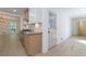Modern kitchen featuring stainless appliances, bright cabinets, and light hardwood floors at 1348 Timberland Se Dr, Marietta, GA 30067
