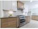 Well-equipped kitchen with stainless steel range, custom cabinetry, and stylish tile backsplash at 1348 Timberland Se Dr, Marietta, GA 30067