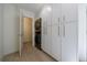 A laundry room with modern washer and dryer, surrounded by wall cabinets at 1348 Timberland Se Dr, Marietta, GA 30067