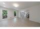 Open floor plan with natural light from windows, showcasing hardwood floors and a smooth transition to the foyer at 1348 Timberland Se Dr, Marietta, GA 30067