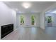 Open floor plan with fireplace and natural light from windows, showcasing hardwood floors and white walls at 1348 Timberland Se Dr, Marietta, GA 30067