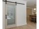 A stylish, frosted glass pantry door provides storage near the kitchen at 1348 Timberland Se Dr, Marietta, GA 30067