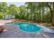 Sparkling in-ground pool features professional landscaping at 1348 Timberland Se Dr, Marietta, GA 30067