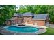 Backyard featuring an in-ground pool, landscaped deck area, and outdoor seating at 1348 Timberland Se Dr, Marietta, GA 30067