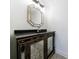 Stylish powder room featuring a unique vanity and decorative mirror with ornate lighting at 1348 Timberland Se Dr, Marietta, GA 30067