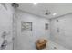 Tiled shower with a hand-held fixture, rain shower, and a built-in tile niche at 1348 Timberland Se Dr, Marietta, GA 30067