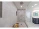 This sleek walk-in shower features modern tile and a clear glass enclosure at 1348 Timberland Se Dr, Marietta, GA 30067