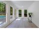 Bright sunroom with backyard and pool view, featuring large windows and hardwood flooring at 1348 Timberland Se Dr, Marietta, GA 30067