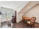 Dining space with hardwood floors, natural light, and a writing desk at 306 Nottaway Ln, Alpharetta, GA 30009