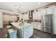 Elegant kitchen with white cabinetry, granite countertops, stainless steel appliances, and a central island at 306 Nottaway Ln, Alpharetta, GA 30009