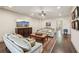 Spacious living room features hardwood floors, a mounted TV, and comfortable couches at 306 Nottaway Ln, Alpharetta, GA 30009