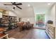 Bright office with hardwood floors, ceiling fan, and a desk with a window view at 306 Nottaway Ln, Alpharetta, GA 30009