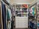 Organized walk-in closet with shelving, drawers, hanging rods, and ample storage space for clothes and accessories at 306 Nottaway Ln, Alpharetta, GA 30009