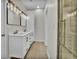 This bathroom features a double sink vanity, tile flooring, and glass enclosed shower at 6022 Fieldcrest Dr, Morrow, GA 30260