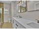 This bathroom features a double sink vanity, tile flooring, and glass enclosed shower at 6022 Fieldcrest Dr, Morrow, GA 30260