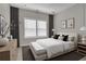 This bedroom features a large window, modern decor, and a neutral color palette at 6022 Fieldcrest Dr, Morrow, GA 30260