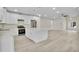 Modern kitchen features stainless steel appliances, an island with a marble countertop, and eat in dining space at 6022 Fieldcrest Dr, Morrow, GA 30260