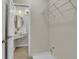This laundry room includes a sink, modern fixtures, and shelving for storage at 6022 Fieldcrest Dr, Morrow, GA 30260