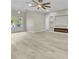 The space has recessed lighting, hardwood flooring, an electric fireplace, built-in shelves and french doors at 6022 Fieldcrest Dr, Morrow, GA 30260