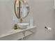 This powder room features a floating sink with quartz countertop and modern fixtures at 6022 Fieldcrest Dr, Morrow, GA 30260