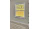 An interior shot of a window with white trim and closed yellow blinds at 6022 Fieldcrest Dr, Morrow, GA 30260