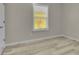 An interior shot of a window with white trim and closed blinds at 6022 Fieldcrest Dr, Morrow, GA 30260